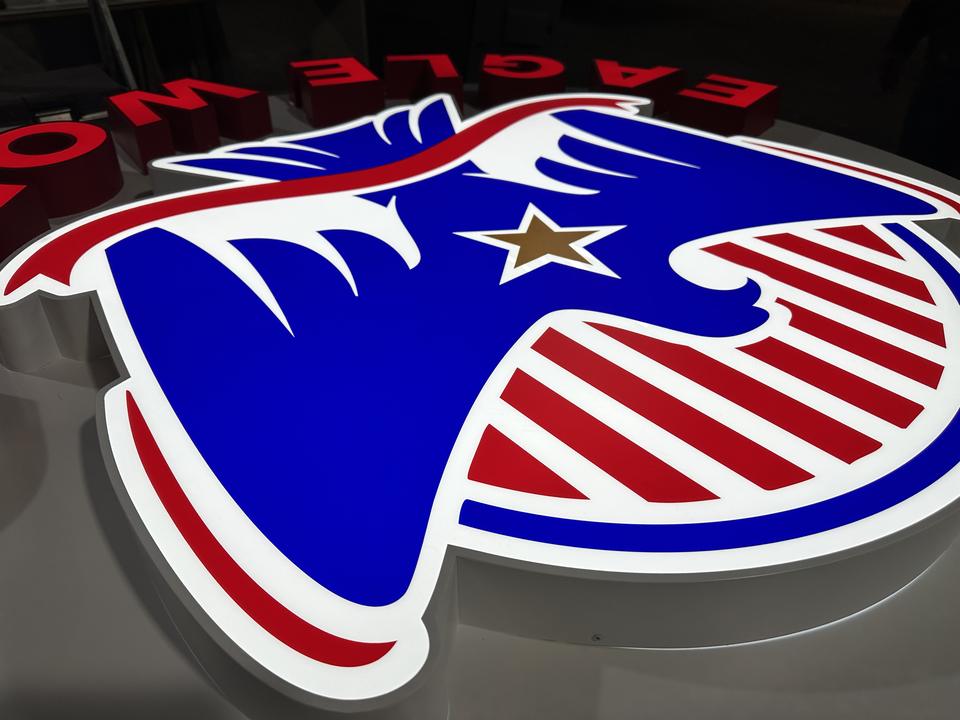 Eagle: Lit acrylic logo, close-up